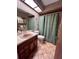 Cozy bathroom with vintage fixtures and a patterned tile floor at 2114 Indian N Ave, Belleair Bluffs, FL 33770