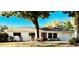 Charming single-story home with a manicured lawn and mature tree offering curb appeal at 2114 Indian N Ave, Belleair Bluffs, FL 33770
