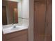 Bathroom with white vanity, mirror, and a glass enclosed shower at 21537 Clubside Loop, Lutz, FL 33549