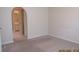 Inviting bedroom featuring neutral walls, carpet, and access to a bathroom at 21537 Clubside Loop, Lutz, FL 33549