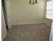 Carpeted dining room with closet, overhead lighting and window at 21537 Clubside Loop, Lutz, FL 33549