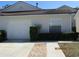 Charming one-story home featuring a one-car garage and tidy landscaping at 21537 Clubside Loop, Lutz, FL 33549
