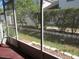 View from screened patio to backyard landscape at 21537 Clubside Loop, Lutz, FL 33549