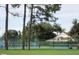Enjoy a match on the community tennis court surrounded by lush landscaping at 21537 Clubside Loop, Lutz, FL 33549