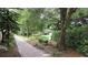 Picturesque walkway meandering through lush greenery and peaceful scenery at 21537 Clubside Loop, Lutz, FL 33549