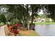 Enjoy the scenic water view and lush landscaping from the dock at 21537 Clubside Loop, Lutz, FL 33549