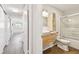 Modern bathroom featuring a stylish vanity with wood drawers, a sleek sink, and a shower with glass doors at 2259 Costa Rican Dr # 23, Clearwater, FL 33763