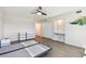 Bedroom with ceiling fan and laminated wood flooring with closet and tropical artwork at 2259 Costa Rican Dr # 23, Clearwater, FL 33763