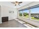 Bedroom featuring wood flooring, a ceiling fan, and neighborhood views at 2259 Costa Rican Dr # 23, Clearwater, FL 33763