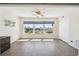 Bedroom featuring wood flooring, a ceiling fan, and pool views at 2259 Costa Rican Dr # 23, Clearwater, FL 33763