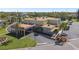 Community clubhouse featuring ample parking, covered entrance, and palm tree landscaping at 2259 Costa Rican Dr # 23, Clearwater, FL 33763
