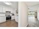 Bright modern kitchen with white cabinetry, stainless steel appliances and breakfast bar at 2259 Costa Rican Dr # 23, Clearwater, FL 33763