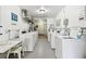 Bright and functional community laundry room with multiple machines and space for folding, making laundry convenient at 2259 Costa Rican Dr # 23, Clearwater, FL 33763