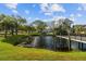 Beautiful pond with a walking bridge and lush landscaping for a tranquil setting at 2259 Costa Rican Dr # 23, Clearwater, FL 33763