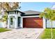 Beautiful home with a modern exterior, a spacious garage, and a well-kept driveway at 2925 W Dewey St, Tampa, FL 33607