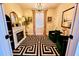 Cozy living room features a fireplace, chandelier, and stylish black and white rug at 2925 W Dewey St, Tampa, FL 33607