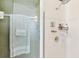 A bathroom with a glass shower, complete with storage for bath items and a towel rack at 3005 Bayshore Pointe Dr, Tampa, FL 33611