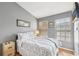 A comfortable bedroom with two windows and a TV mounted on the wall at 3005 Bayshore Pointe Dr, Tampa, FL 33611