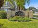 Well-maintained community sign for Bayshore Pointe, adorned with flowers and lush green grass at 3005 Bayshore Pointe Dr, Tampa, FL 33611