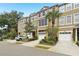 Charming townhome with attached garage, well-maintained landscaping, and a welcoming facade at 3005 Bayshore Pointe Dr, Tampa, FL 33611
