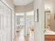 Bright hallway showcases doors leading to rooms filled with natural light and clean finishes, offering a welcoming feel at 3005 Bayshore Pointe Dr, Tampa, FL 33611