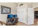 A home office with a large desk, monitors, and a closet at 3005 Bayshore Pointe Dr, Tampa, FL 33611