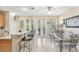 Open concept kitchen with granite countertops, bar seating and view to dining area at 3005 Bayshore Pointe Dr, Tampa, FL 33611