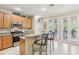 Well-lit kitchen featuring granite countertops, stainless steel appliances, and bar seating at 3005 Bayshore Pointe Dr, Tampa, FL 33611