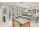 Open kitchen and dining space featuring granite counters, stainless appliances, and abundant natural light at 3005 Bayshore Pointe Dr, Tampa, FL 33611