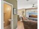 Bright living room view leading to half bath with decorative accents and wood flooring at 3005 Bayshore Pointe Dr, Tampa, FL 33611