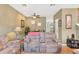 Inviting living room with a comfortable sofa, ceiling fan and bright natural light at 3005 Bayshore Pointe Dr, Tampa, FL 33611