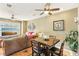 Cozy living room featuring hardwood floors, ceiling fan, and ample seating at 3005 Bayshore Pointe Dr, Tampa, FL 33611