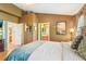 Main bedroom featuring wood floors, ensuite bathroom, high ceilings, and natural light at 3005 Bayshore Pointe Dr, Tampa, FL 33611