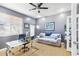 Comfortable office with gray walls, hardwood floors, seating area, and desk at 3005 Bayshore Pointe Dr, Tampa, FL 33611