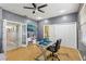 Spacious office with natural light, gray walls, hardwood floors and ceiling fan at 3005 Bayshore Pointe Dr, Tampa, FL 33611