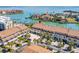 Coastal townhomes featuring manicured grounds, private garages, and breathtaking waterfront views and boat docks at 301 Madeira Cir, Tierra Verde, FL 33715