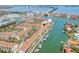 An aerial shot of a condo community with boat slips and waterfront views near a causeway at 301 Madeira Cir, Tierra Verde, FL 33715