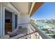 Relaxing balcony featuring a comfortable hammock and serene views of the waterfront and boat docks at 301 Madeira Cir, Tierra Verde, FL 33715