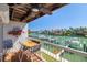 Waterfront balcony with seating offers stunning views of the canal and neighboring homes at 301 Madeira Cir, Tierra Verde, FL 33715