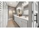Elegant bathroom featuring a double vanity, with pristine white countertops and modern fixtures at 301 Madeira Cir, Tierra Verde, FL 33715