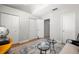 Cozy bedroom with multiple closets, wood floors, and seating area at 301 Madeira Cir, Tierra Verde, FL 33715