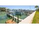 Picturesque boat docks with multiple boats, showcasing waterfront living and boating opportunities at 301 Madeira Cir, Tierra Verde, FL 33715