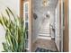 Inviting foyer with tile floors, stairs, decor, and a warm ambiance, leading to the home's interior at 301 Madeira Cir, Tierra Verde, FL 33715