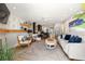 Open-concept living space with fireplace, plush seating, and views into the kitchen at 301 Madeira Cir, Tierra Verde, FL 33715