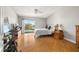 Spacious main bedroom with wood floors, walkout to patio and views of the landscape at 301 Madeira Cir, Tierra Verde, FL 33715