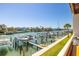 Beautiful view of the canal and boats from the balcony with well-maintained seawall at 301 Madeira Cir, Tierra Verde, FL 33715