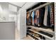 Well-organized walk-in closet featuring shelving, hanging rods, and ample storage space at 301 Madeira Cir, Tierra Verde, FL 33715