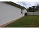 Large backyard featuring grass, a privacy fence and exterior home access at 30829 Iverson Dr, Wesley Chapel, FL 33543