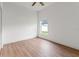 Bright, empty bedroom with wood flooring and a window offering natural light at 30829 Iverson Dr, Wesley Chapel, FL 33543