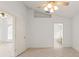The spacious primary bedroom features a ceiling fan and ensuite bathroom with a garden tub and separate shower at 30829 Iverson Dr, Wesley Chapel, FL 33543